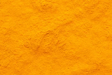 Rolgordijnen curcuma turmeric spice powder full frame rough surface © orinocoArt