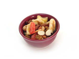Dried fruit in a bowl isolated on white