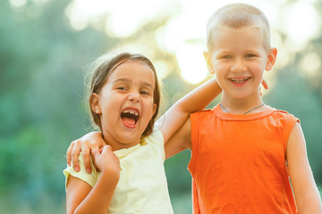 Portrait Of Children With Friends On Hiking Adventure In Woods