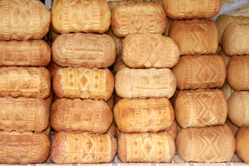 Oscypek cheese in round form - traditional mountain product of Poland, Zakopane. Cheese is made of goat, cow and sheep milk