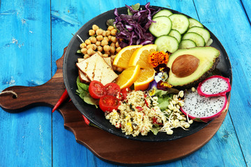 grilled tofu and dragon fruit buddha bowl with vegetable and humus