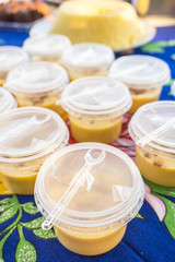 Brazilian Curau with cinnamon in plastic cups