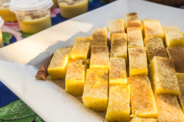 Slices of brazilian curau with cinnamon