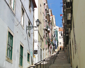 Fototapeta na wymiar Lisboa. A very small alley with steps