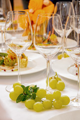 festive table glasses for Champagne and grapes