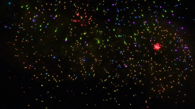 Colorful multiple closeup firework, footage abstract background tv show, intro, opener, christmas theme, holiday, new year, party, clubs, event, music clips, advertising. Bright colors salute