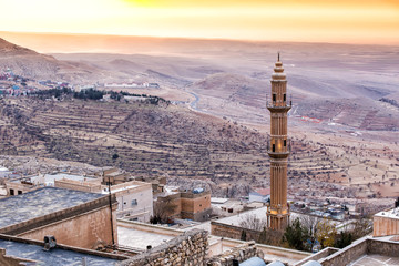 Beautiful Mardin old city landscape from Minaret of the Great Mosque. It known also as Ulu Cami. Old minaret with mesopotamian plain in the background in Turkey