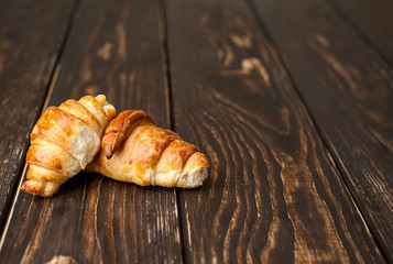 croissants on wooden background