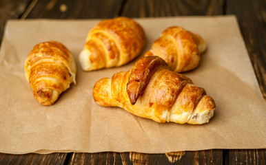 croissants on wooden background