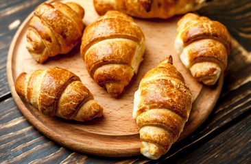 croissants on wooden background