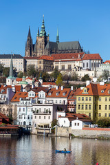Fototapeta premium Colorful autumn Prague gothic Castle with the Lesser Town above River Vltava in the sunny Day, Czech Republic