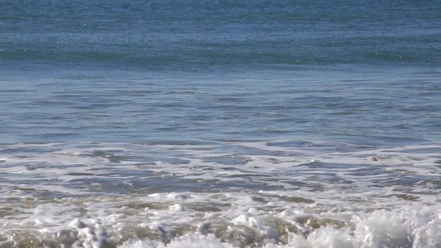 Light Breeze waves at sea Algave Portugal.