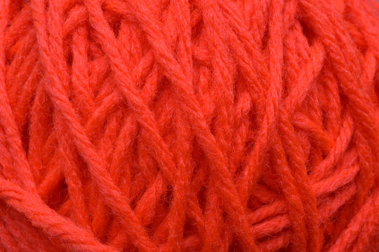 A Close Up Of A Orange Ball Of Yarn