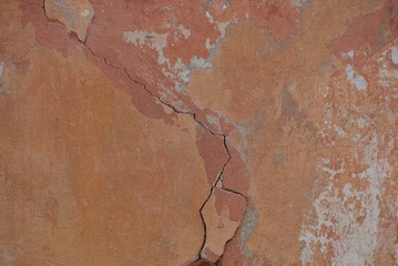 gray brown stone background from an old concrete wall with a crack