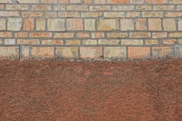 brown stone texture of bricks and plaster on the wall