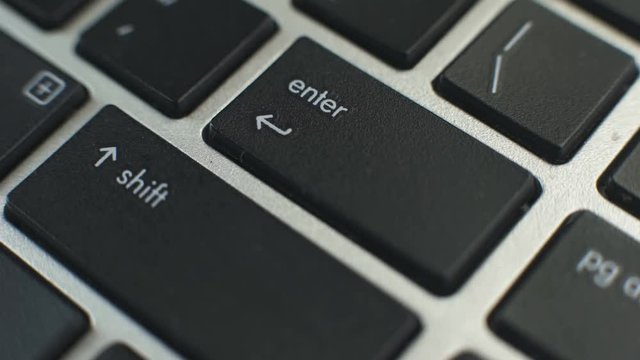 Female hand pressing enter button on laptop keyboard, data entry, secured access