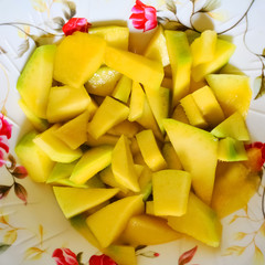 Chopped mango on a plate. Delicious tropical fruit