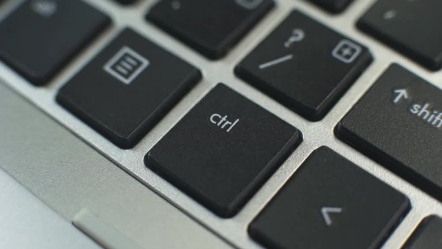 Female hand pressing control key to perform special operation with pc programs