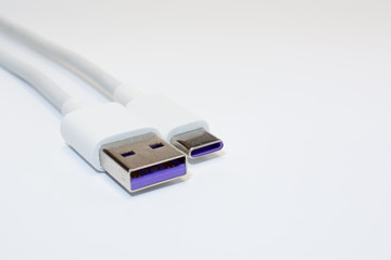 USB type C and USB 3.0 cables on white background