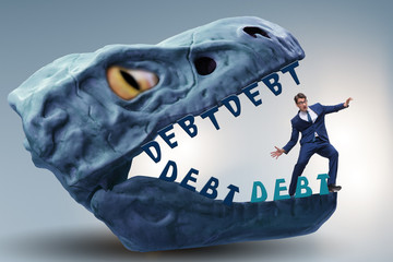 Businessman in the jaws of debt and loan