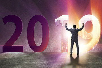 Businessman in the concept of transition to year 2019