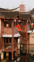 Traditional chinese architecture with a pagoda in the back in Qibao old town Shanghai, China