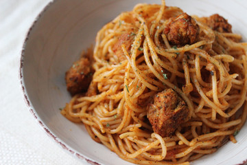 tasty vegan pasta in tomato sauce with soya 