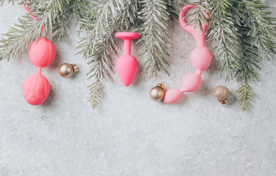 Various sex toys, christmas balls. New Year or Christmas festive background for Sex shop