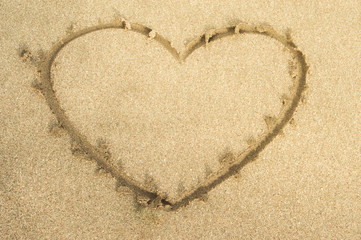 love heart drawing on beach sand