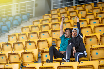 Asian couple at track stadium exercising for healthy lifestyle