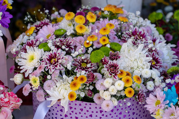 Mixed flower bouquets for sale at a local farmer market . Close up