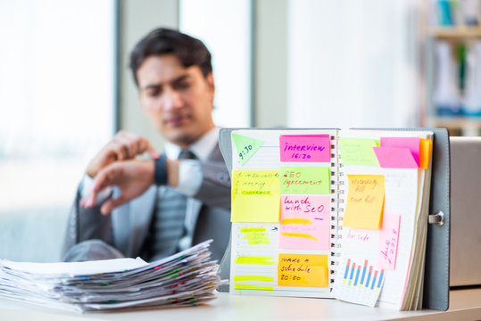 Young successful businessman working at the office 