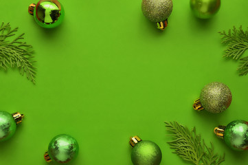 Flat lay, Top view minimal composition background of green decorative Christmas ornaments. New Year and Christmas concept with copyspace.