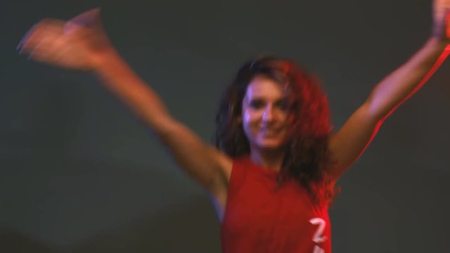 girl dancing zumba fitness workout in a studio