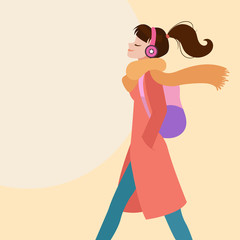 Woman walking while listening to music on headphones