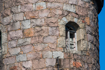 Ancient stone tower with a window