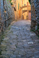 Narrow street in historic center of  Montalcino town, Val d'Orcia, Tuscany, Italy