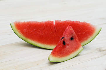 Close up of Sliced watermelon on wooden table backgrounds
