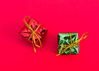 Two gift boxes on red background