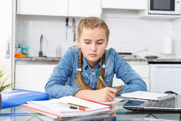 Teenage girl doing her home task