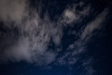 Naklejka na ściany i meble light cloud coverage over starry night covering starry night 