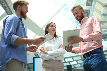 Fototapeta premium Picture of young designers using tablet in office.