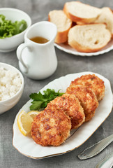 Chicken cutlets with rice on a plate for dinner