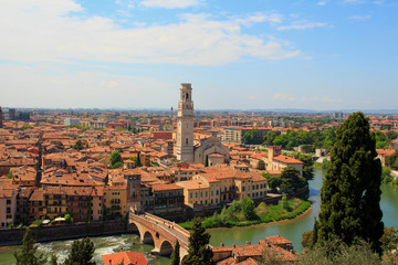 Obraz premium Aerial view of old city Verona with orange rooftops and high towers in sunny day. , Italy