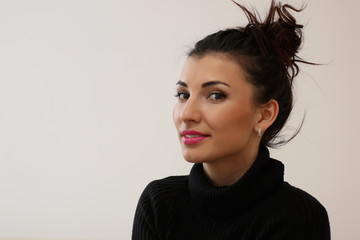 A young woman look on the window