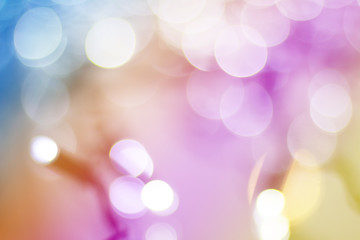 Obraz premium Abstract background. Christmas lights blurred background with bokeh. New Year glowing garland. Toned