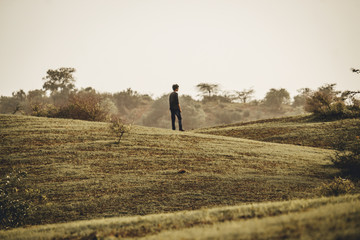Fototapeta premium Man in front of the hill