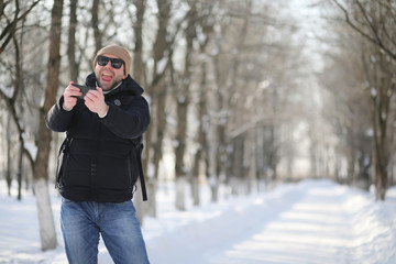 A man with a backpack frosty winter