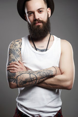 Smiling Hipster boy. handsome man in hat