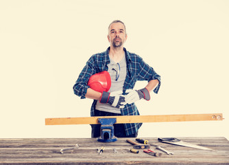 worker in blue  shirt sawing wood